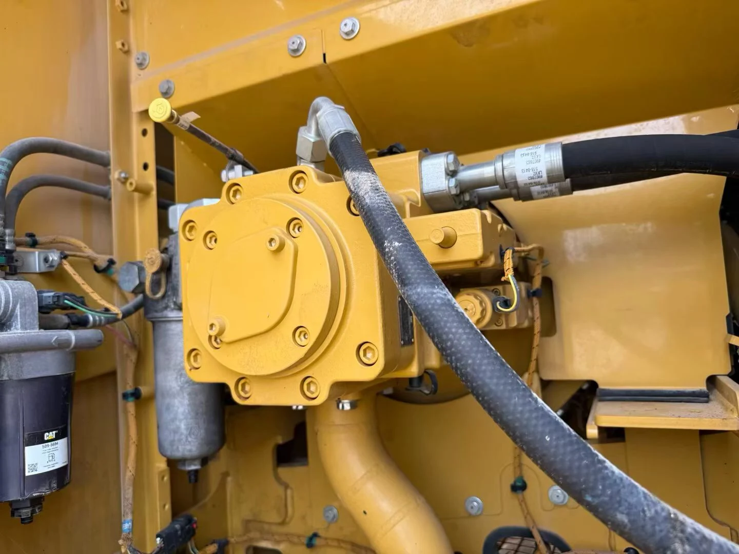 Hydraulic pump compartment on a high-hour used excavator